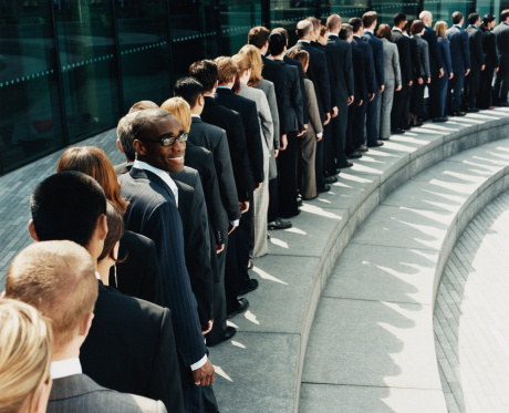 Business people standing in line